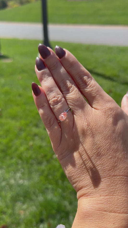 1.68 carat Fancy Vivid Pink Pear Diamond